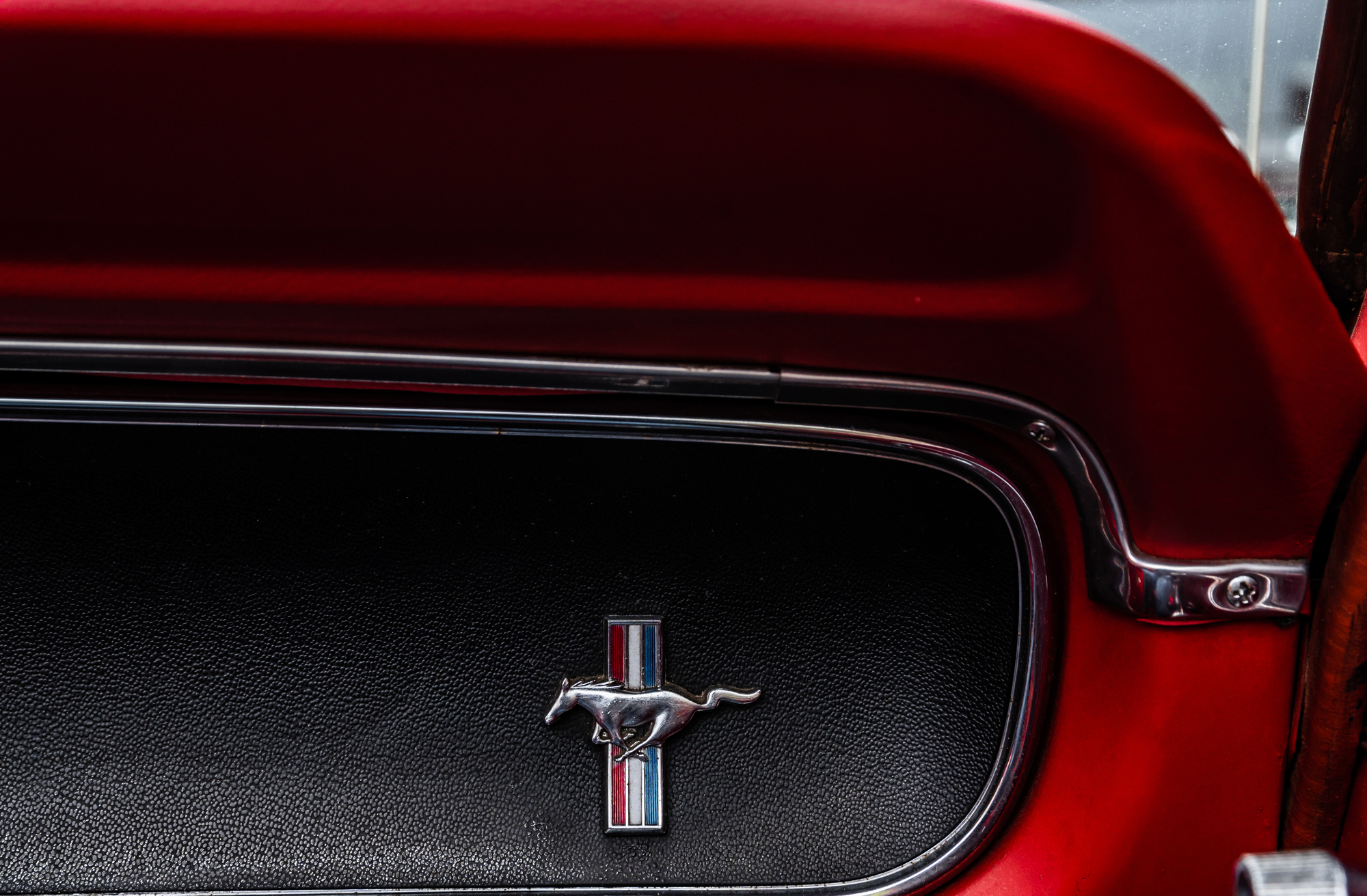 Close up dashboard photo of a Ford Mustang