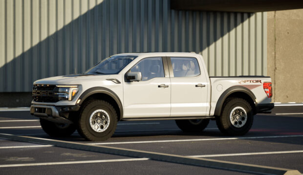 Side view of white Ford Raptor pick-up truck under a bridge